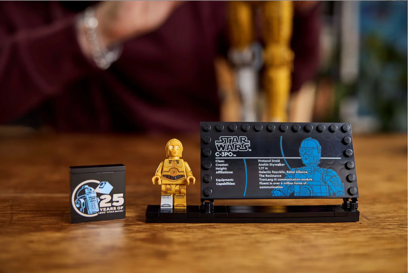 LEGO Star Wars C-3PO set featuring a detailed minifigure and a display plaque highlighting character information.