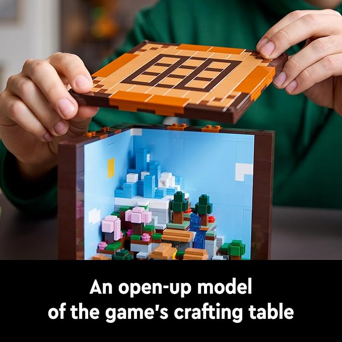 Open model of LEGO Minecraft crafting table featuring a colorful interior scene with trees and flowers.