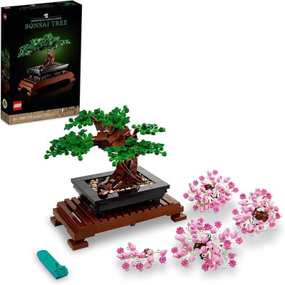 LEGO Botanicals Bonsai Tree set with green tree, pink blossoms, and black pot on a wooden stand, featuring the box.