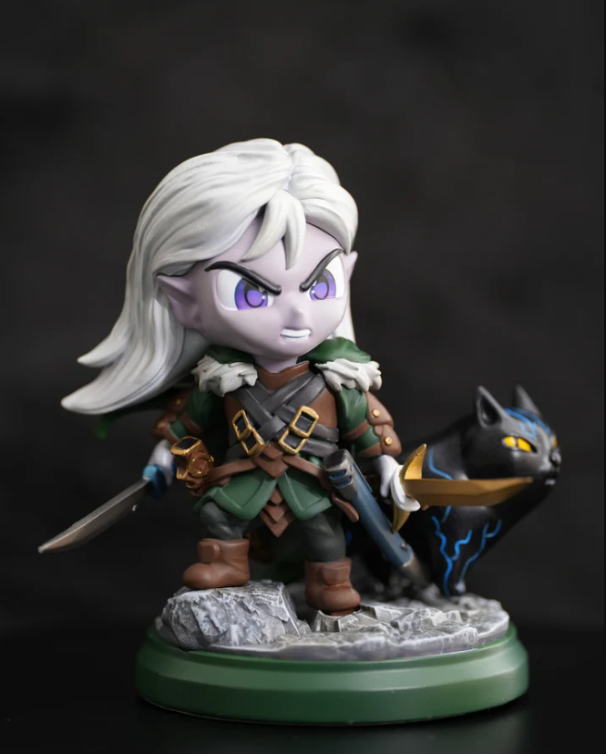 Chibi-style figure of Drizzt Do'urden with Guenhwyvar, featuring detailed expressions and accessories, set on a rocky base.
