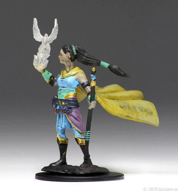 Premium Dungeons & Dragons female elf druid miniature holding a staff and a magical creature, with a flowing cape.