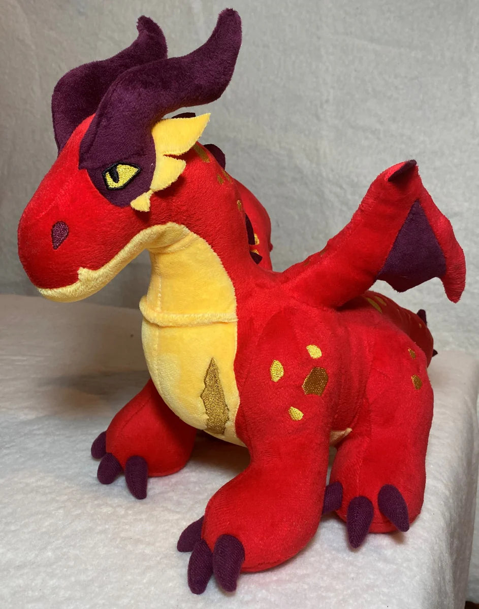 Red and yellow plush dragon from Earthdawn, featuring detailed stitching and vibrant colors, perfect for collectors and fans.