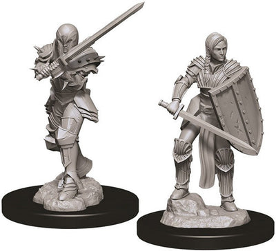 Unpainted miniatures of a female human fighter wielding a sword and shield, designed for Dungeons & Dragons gameplay.