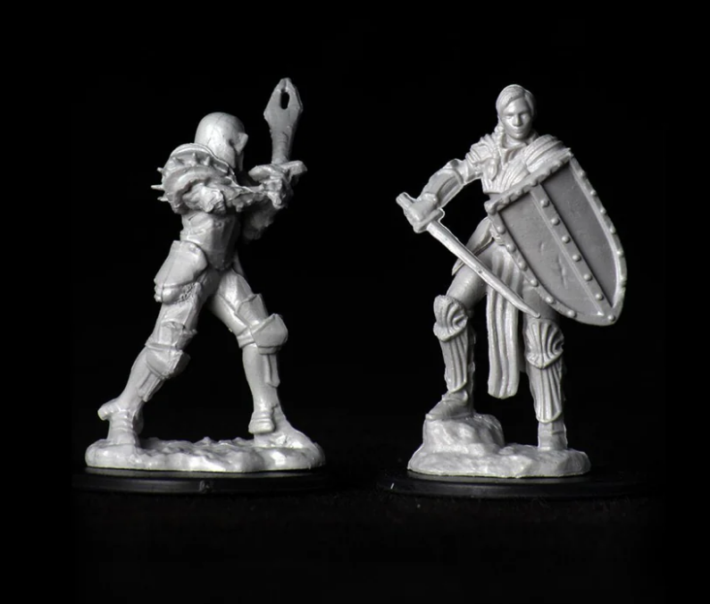 Unpainted miniatures of a female human fighter from Dungeons & Dragons, showcasing dynamic poses and detailed armor.