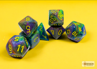 Chessex Festive Rio/Yellow 7 Die Set featuring vibrant multicolored dice with yellow numbers on a bright yellow background.