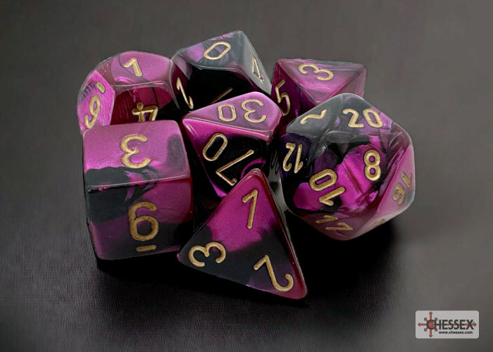 Chessex Gemini Black-Purple/Gold 7-die set featuring vibrant black and purple colors with gold numbering.