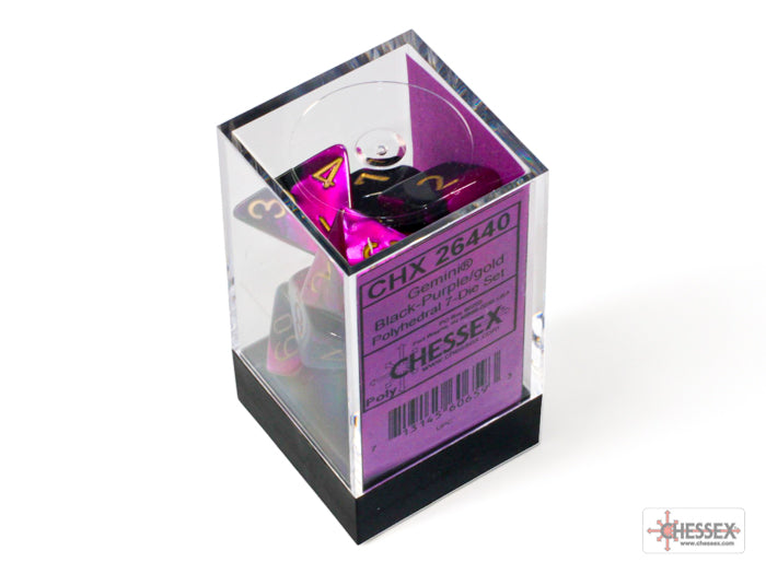 Chessex Gemini Black-Purple/Gold 7-die set displayed in a clear box, featuring vibrant black and purple dice with gold numbers.