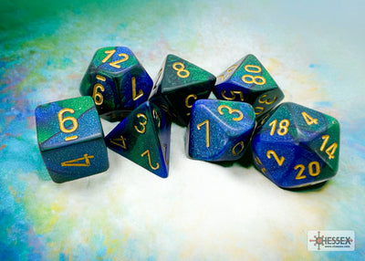 Chessex Gemini Blue-Green/Gold 7-die set featuring vibrant blue-green dice with gold numbers, ideal for tabletop gaming.