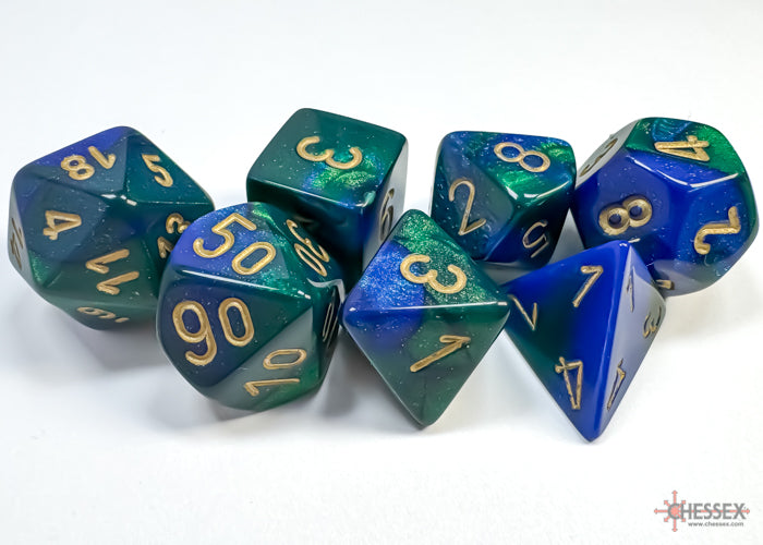Chessex Gemini Blue-Green/Gold 7-die set featuring vibrant blue-green colors with gold numbering on each die.