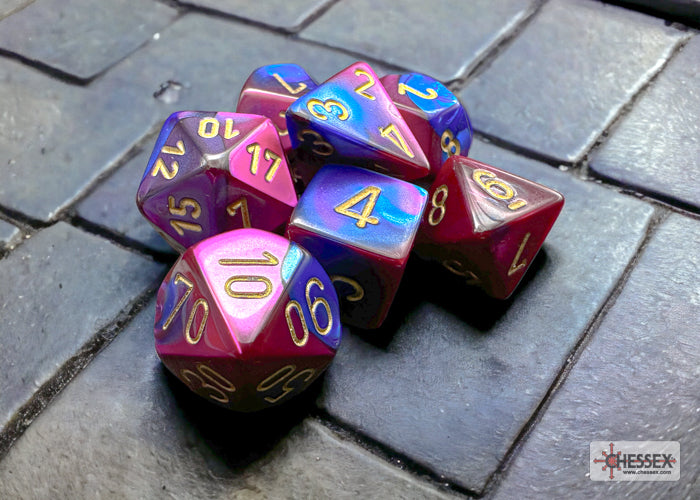 Gemini blue-purple and gold 7-die set from Chessex, featuring vibrant colors and clear numbering on each die.