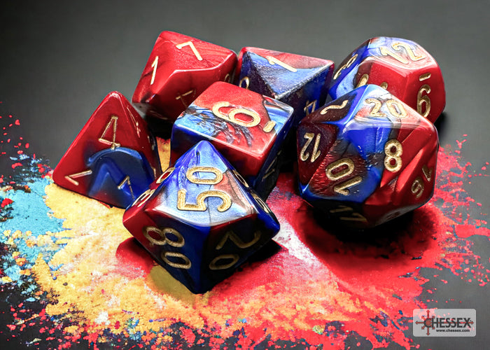 Chessex Gemini Blue-Red/Gold 7-die set featuring vibrant blue and red colors with gold numbering on a colorful background.