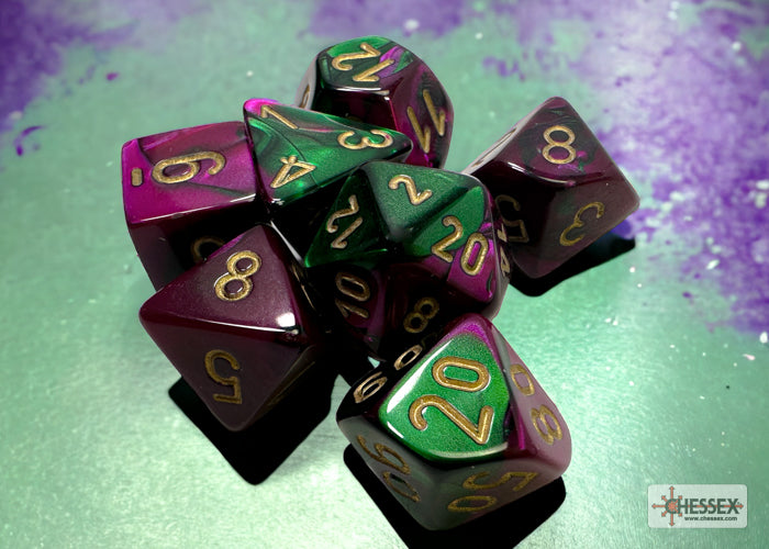 Chessex Gemini Green-Purple/Gold 7-die set featuring vibrant green and purple colors with gold numbering.