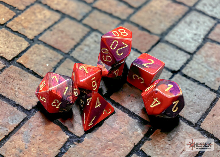 Chessex Gemini Purple/Red 7-die set featuring vibrant purple and red colors with gold numbering on each die.