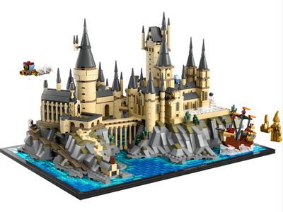 Detailed LEGO model of Hogwarts Castle and Grounds featuring towers, water, and a ship, capturing the magical essence of Harry Potter.