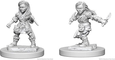 Unpainted miniature of a female halfling rogue from Dungeons & Dragons, featuring detailed armor and a dagger.
