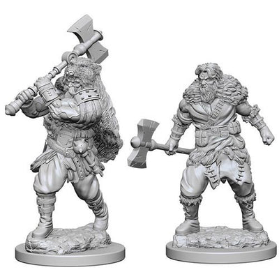 Unpainted miniatures of a human male barbarian wielding a large axe, showcasing detailed features and dynamic poses.