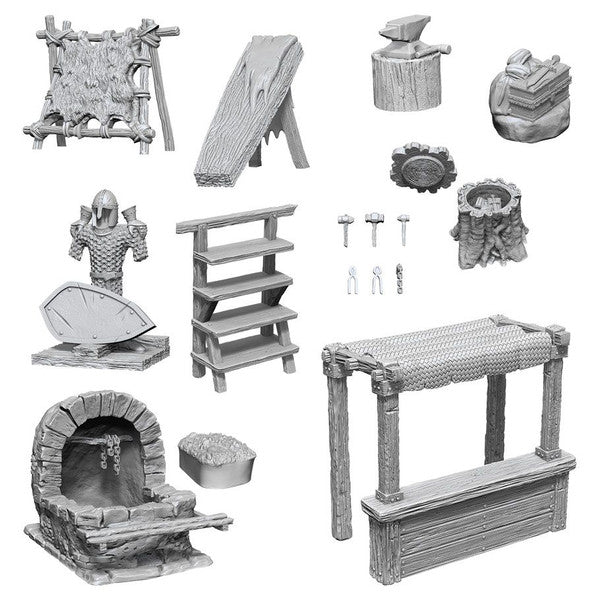 Unpainted miniatures of townspeople and accessories, including a forge, tools, and various props for tabletop gaming.