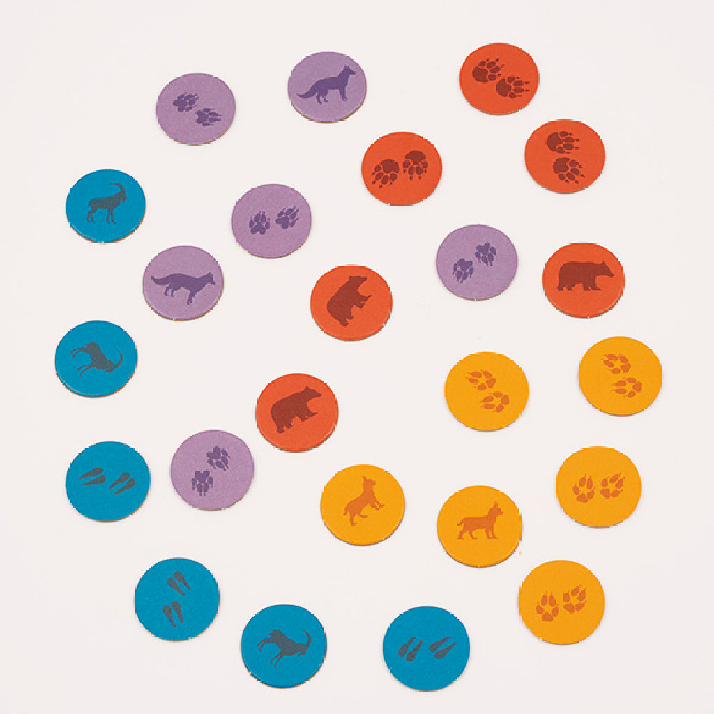 Colorful game tokens featuring animal tracks and silhouettes, designed for the Just Wild board game.