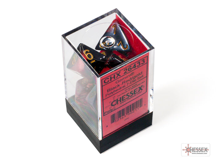 Chessex Gemini Black-Red/Gold Polyhedral 7-Dice Set displayed in a clear box, featuring sharp edges and vibrant colors.