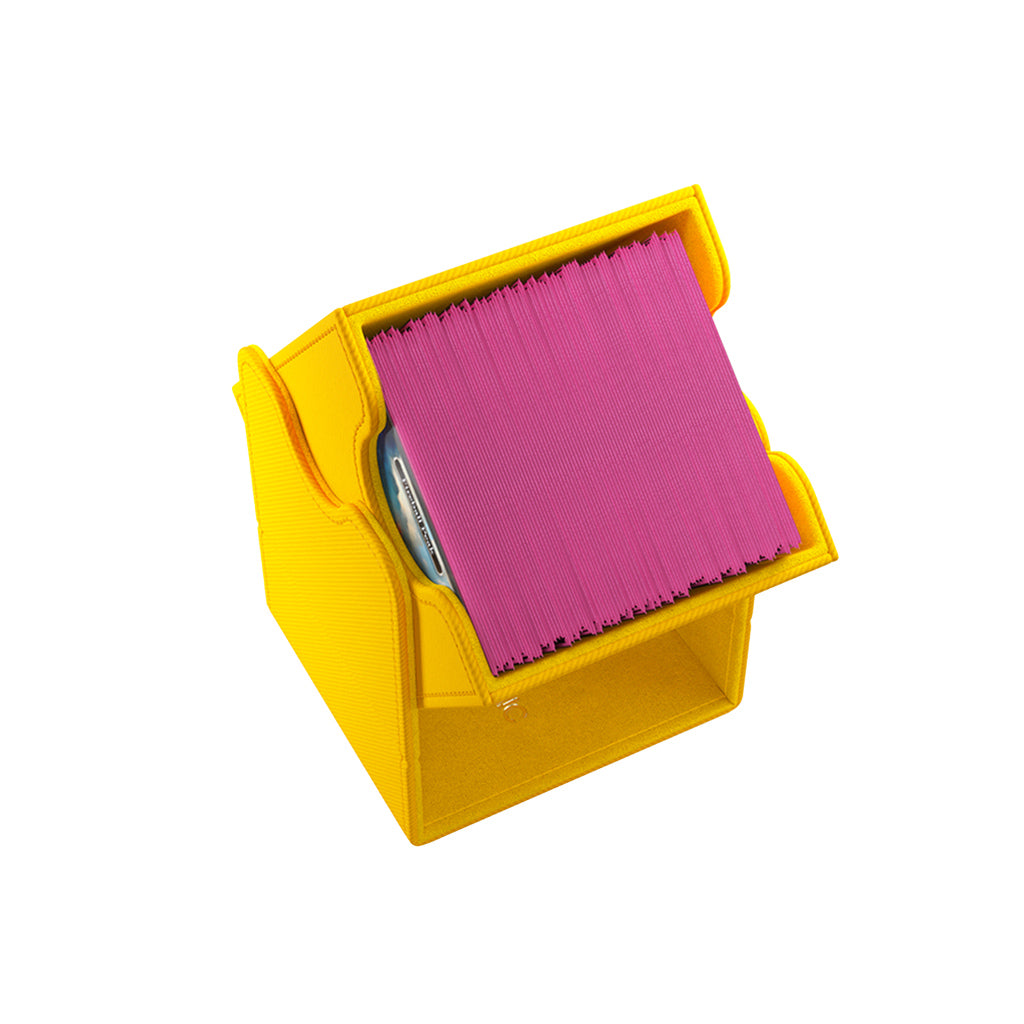 Gamegenic Deck Box Squire 100+ XL in yellow, designed to hold trading cards with a vibrant pink card sleeve inside.