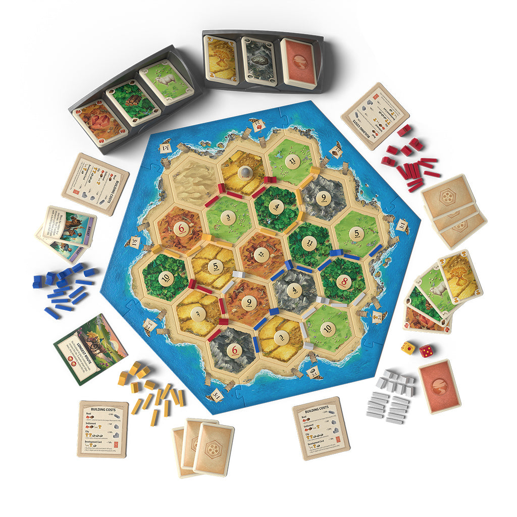 Catan 6th Edition board game setup featuring hexagonal tiles, resource cards, player pieces, and dice arranged on a table.