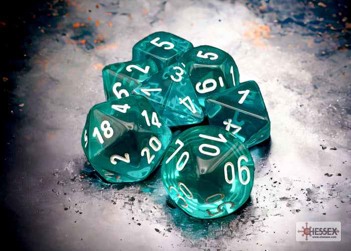 Translucent teal and white polyhedral 7-dice set by Chessex, featuring clear numbers on each die.