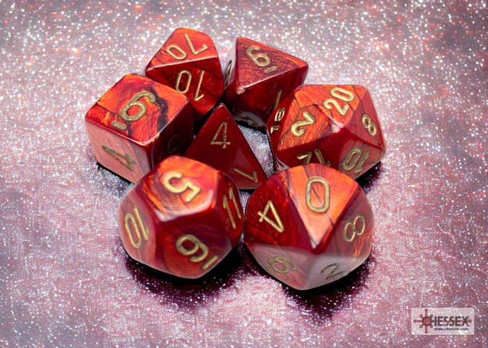 Chessex Scarab Scarlet/Gold Polyhedral 7-Dice Set featuring red dice with gold numbering on a glittery background.