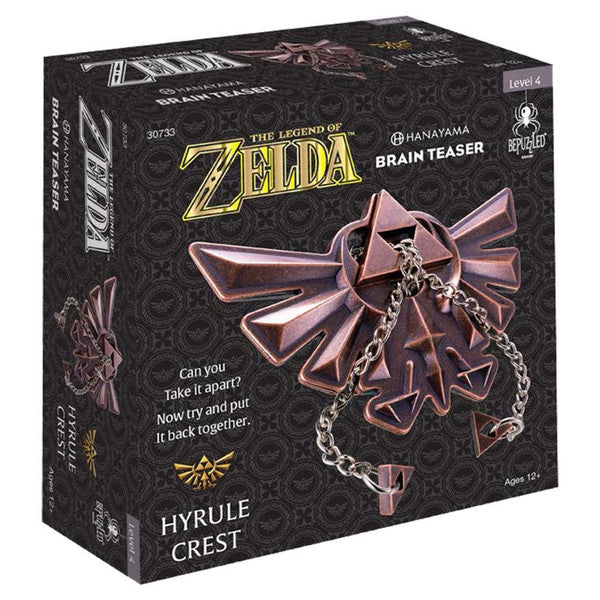 Hanayama Zelda Hyrule Crest Level 4 puzzle box featuring a detailed 3D design of the Hyrule Crest and chain.