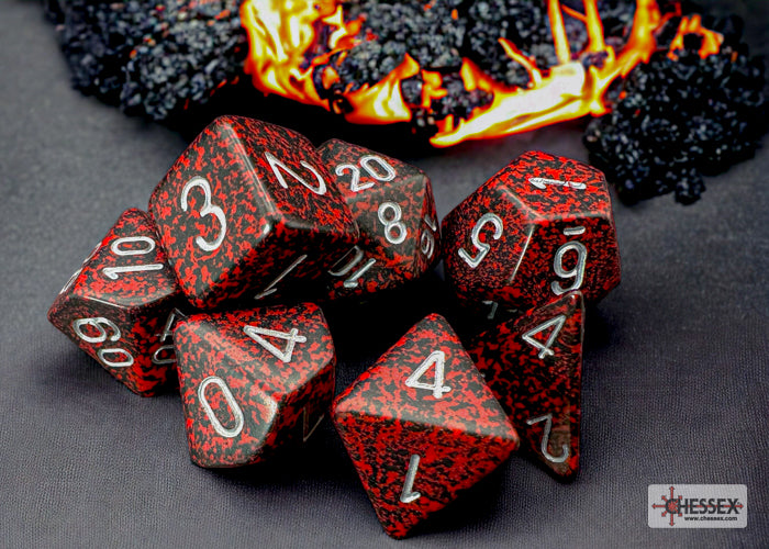 Chessex Speckled Silver Volcano Polyhedral 7-Dice Set featuring red and black dice with silver numbers against a fiery background.