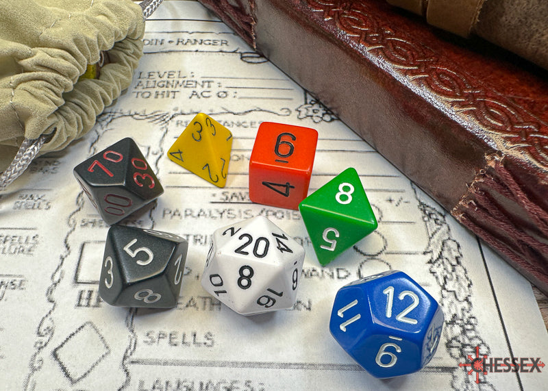Chessex Nostalgia Opaque polyhedral 7-dice set in various colors on a gaming map, with a dice bag and rulebook.