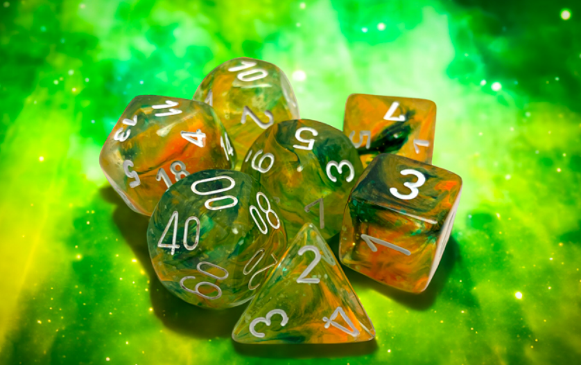 Chessex Nebula Spring White Luminary 7 Die Set featuring vibrant green and orange translucent dice with white numbers.