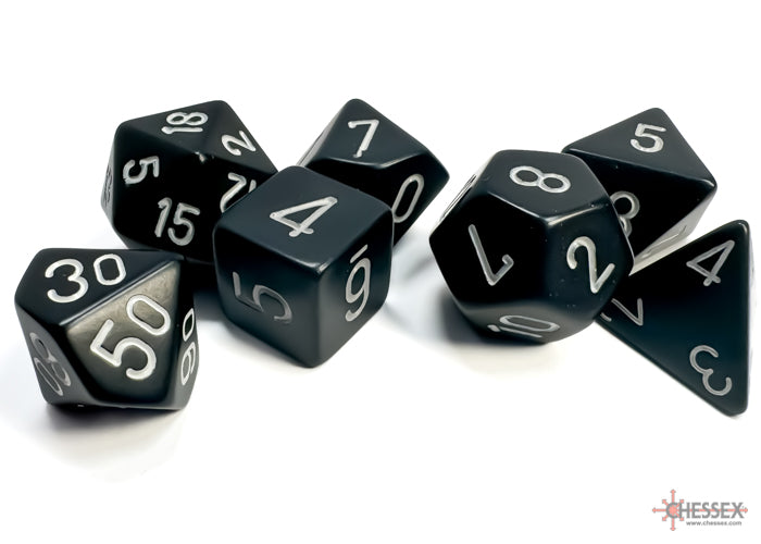 Chessex opaque black 7-die set featuring various polyhedral dice with silver numbers for tabletop gaming.