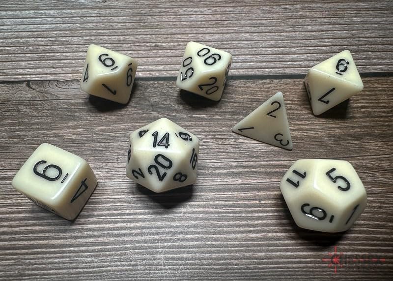 Chessex Opaque Ivory and Black 7-die set featuring various polyhedral dice for tabletop gaming.