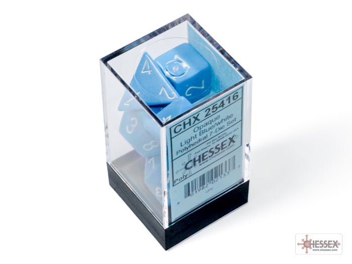 Opaque light blue and white 7-die set by Chessex displayed in a clear box, showcasing the dice's numbers and colors.