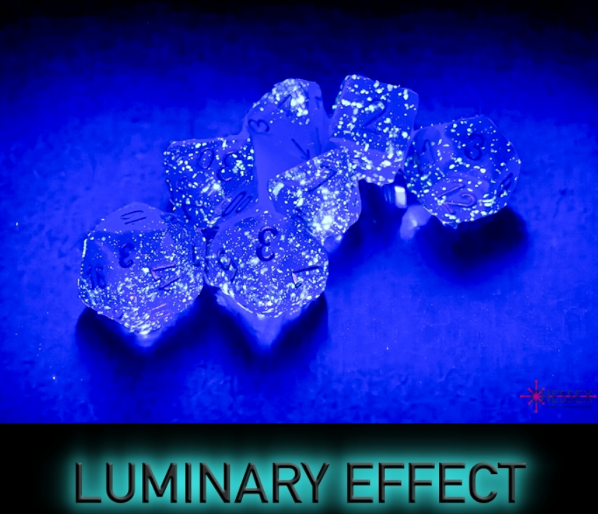 Chessex Borealis Royal Purple and Gold Luminary 7-die set glowing under UV light, showcasing vibrant colors and sparkles.