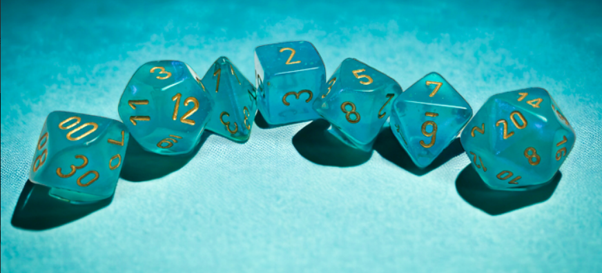 Chessex Borealis teal and gold luminary polyhedral 7-die set arranged in a curve on a soft blue background.