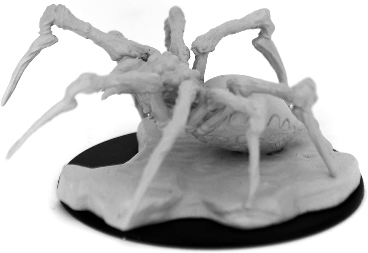 Unpainted miniature of a Phase Spider from Dungeons & Dragons, featuring detailed legs and a textured base.