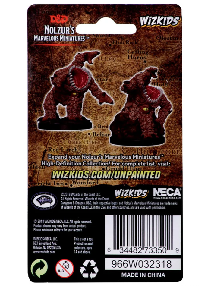 Unpainted Dungeons & Dragons Nolzur's Marvelous Miniatures W05 Xorn figure, showcasing detailed sculpting on a backing card.