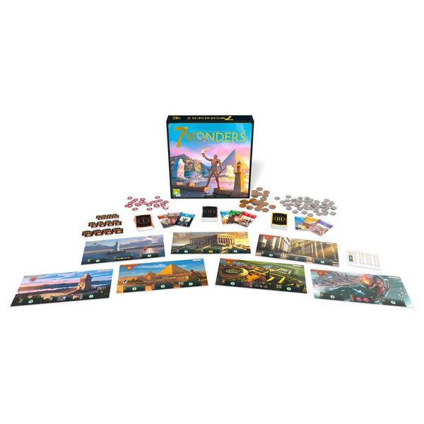 7 Wonders board game box with game components, including cards, tokens, and player boards arranged around it.