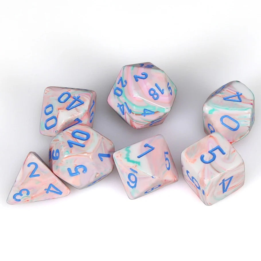 Chessex Festive 7ct dice set in Pop Art/Blue features colorful marbled designs with blue numbers for tabletop gaming.