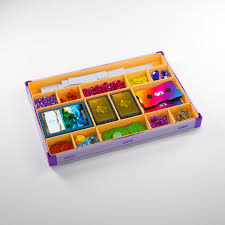 Gamegenic Token Silo XL Convertible in orange and purple, featuring organized compartments for tokens, cards, and gaming accessories.