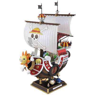 Model kit of the Thousand Sunny ship from One Piece, featuring detailed sails, vibrant colors, and iconic pirate motifs.