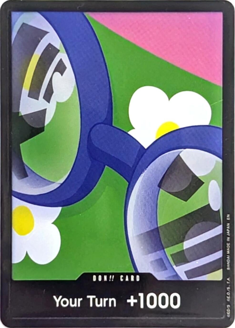 DON!! Card featuring colorful magnifying glasses and a floral background, labeled "Your Turn +1000.
