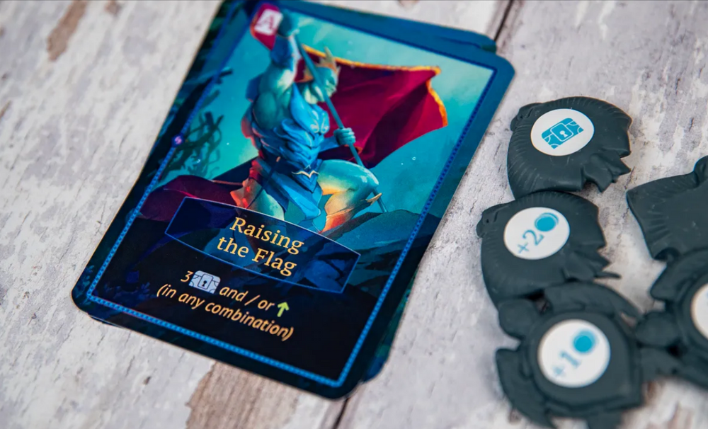 Aquatica Duellum preorder card featuring "Raising the Flag" artwork with game tokens on a rustic wooden surface.