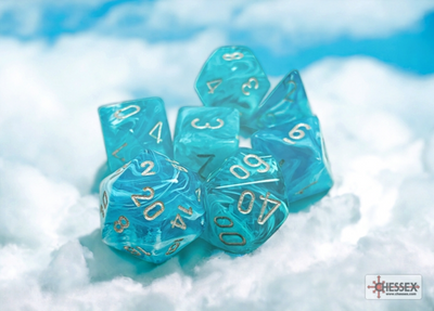 Chessex Cirrus Aqua/Silver 7-die set featuring translucent teal dice with silver numbering, resting on a cloud-like background.