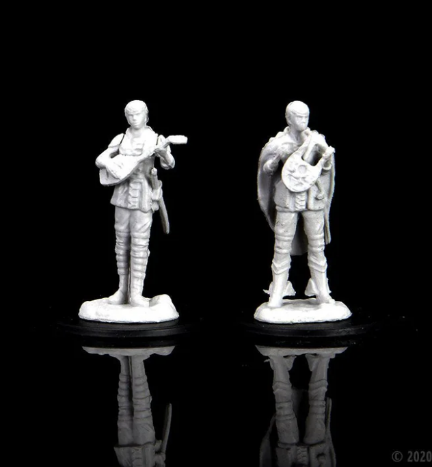 Unpainted miniatures of a female half-elf bard from Dungeons & Dragons, featuring two poses with instruments.