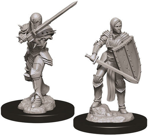 Unpainted miniatures of a female human fighter wielding a sword and shield, designed for Dungeons & Dragons gameplay.