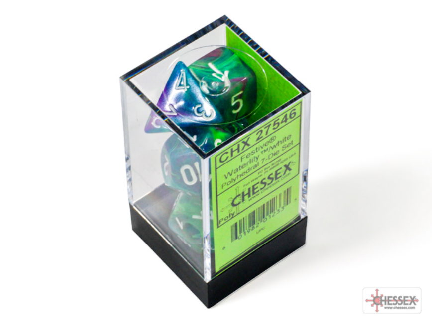 Chessex Festive Waterlily/White 7 die set displayed in a clear box, featuring vibrant colors and unique designs.