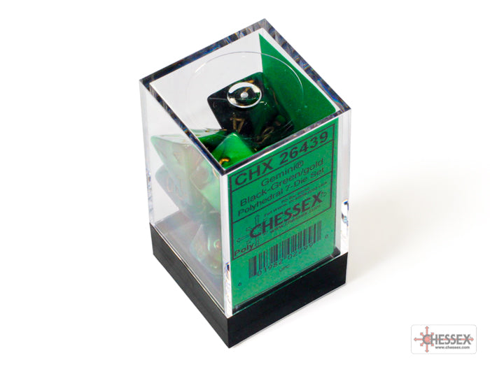 Chessex Gemini Black-Green/Gold 7-die set in a clear display box, featuring polyhedral dice with a glossy finish.