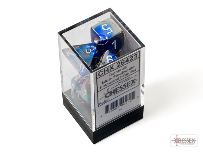 Chessex Gemini Blue/Steel 7-die set displayed in a clear box, showcasing vibrant blue and steel-colored polyhedral dice.